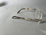 an image of a pair of glasses sitting on top of a table