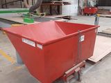 the large red container is sitting on a dolly in the warehouse