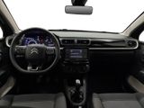 the interior of a small car with a steering wheel and dashboard