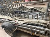 a truck with a metal cage on the back and a tarp on the back