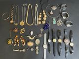 many different types of jewelry displayed on the table