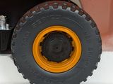 a toy truck that is sitting on a white surface