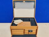 a small wooden box with a drawer on top of a table
