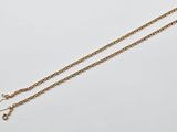 an image of a gold necklace with a chain on it