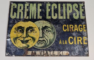 une affiche sur laquelle on peut lire « Crème Eclipse » et qui comporte l'image de deux visages
