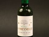 a bottle of wine that is sitting on a table