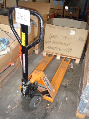 a pallet with a sign on it sitting in a warehouse