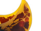 a vase that has a yellow and red design on it