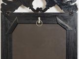 a picture of a mirror hanging on the wall