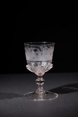 a glass cup that is sitting on a table