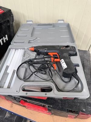 a box with a drill and other tools on top of it