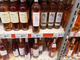 many bottles of wine on the shelves in the store