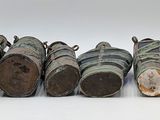 several pieces of wood are lined up in a row on a white surface