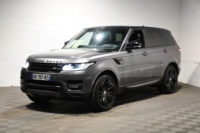 an image of a grey range rover parked in a garage