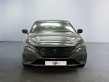 the front view of a grey car in a showroom
