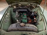 a small engine in the back of a green car