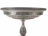 an image of a silver plate with a design on it