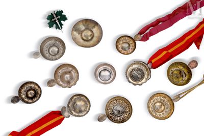a lot of different metal objects on a white surface