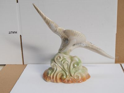 a bird that is sitting on top of a piece of paper