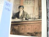 an open book with a picture of a man sitting at a desk