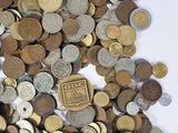 a pile of coins that are on a table
