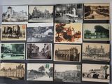 many pictures of old buildings on display on the wall