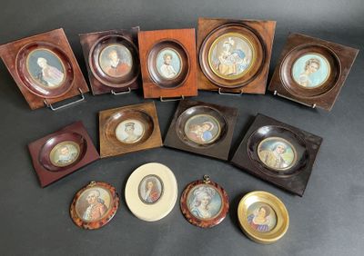 several different types of framed pictures are on display on a table