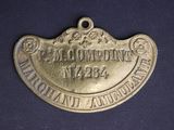 an old brass plate with the name of a company