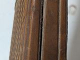 a close up of a knife with a wooden handle