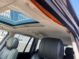 a view of the sunroof from inside of a car