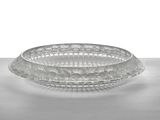 a glass bowl that is sitting on a table