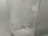 a clear glass with a picture of a boat on it