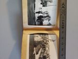 two old photos hanging on a wall next to a ruler