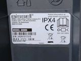 a close up of a parking meter with a sticker on it