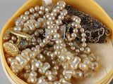 a yellow box with a bunch of pearls in it