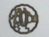 a small metal object with a bird on it