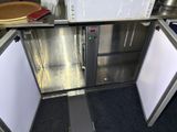 a stainless steel kitchen with a microwave and a dishwasher
