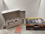 a white box with a game controller inside of it