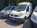 three white vans parked next to each other in a parking lot