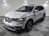 the white renault suv is parked on a checkered floor