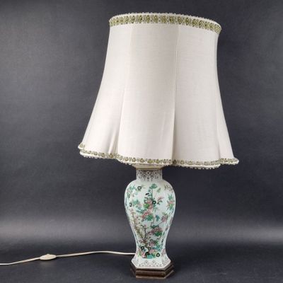 a white lamp with a white shade on top of it