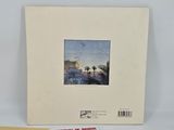 a white album with a picture of a castle on top of it