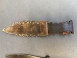 a knife and a knife blade on a table