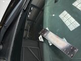 a piece of luggage that is sitting in the back seat of a car