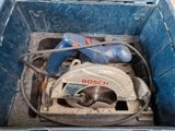 a blue box that has a circular saw in it