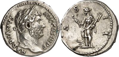 a silver coin with an image of a man holding a sword