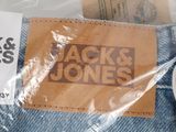 a pair of blue jeans with a sticker on it