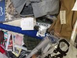 a plastic bag full of clothes and other items in it