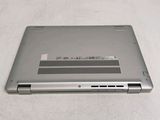a laptop that is sitting on a white surface