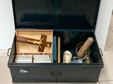 a black suitcase with a bunch of items inside of it